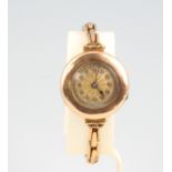 A lady's 9ct yellow gold wristwatch on a ditto expanding bracelet The watch is not working