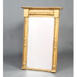 A Regency rectangular plate pier mirror contained in a gilt frame with column decoration 92cm x 59cm