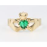 A 9ct yellow gold gem set Claddagh ring size S