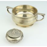 A silver twin handled porringer Birmingham 1947 184 grams, together with an Eastern white metal