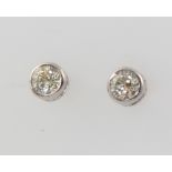 A pair of 18ct white gold brilliant cut diamond ear studs, approx 0.65ct