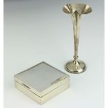 A plain silver cigarette box with hinged lid, Birmingham 1934, 3cm h x 8.5cm w x 9cm d together with