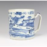 An 18th Century Chinese porcelain blue and white mug decorated with an extensive landscape scene