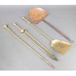 A Victorian brass 2 piece fireside companion set comprising tongs and shovel together with a brass