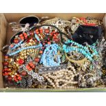 A quantity of costume jewellery including brooches, necklaces etc
