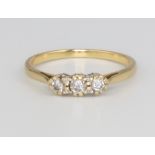 An 18ct yellow gold 3 stone diamond ring, approx. 0.15ct, size O 1/2