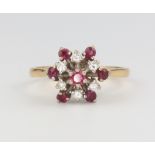 An 18ct yellow gold ruby and diamond cluster ring, size P, 4.3 grams