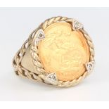 A half sovereign 2000 ring in a 9ct gold mount, mount 3 grams, size U 1/2