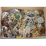 A quantity of costume jewellery including brooches and necklaces