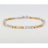 An 18ct yellow gold 2 colour diamond bracelet, 12.7 grams