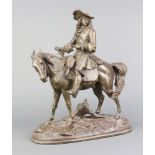 A 19th Century spelter figure of a mounted cavalier raised on oval naturalistic base 35cm x 29cm x
