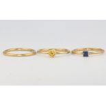 Three 18ct yellow gold rings, 2 gem set, size N, 4.8 grams