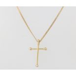 An 18ct yellow gold diamond set cross pendant and chain, 7.4 grams