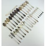 18 various silver teaspoons, silver butter knife, 2 silver forks, 2 pairs of silver sugar tongs, 6