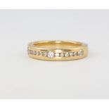 An 18ct yellow gold diamond band, size I, 4.5 grams