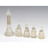 A cut glass scent bottle with silver collar 17cm and 4 other cut glass scent bottles
