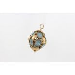 A 9ct yellow gold blue topaz charm