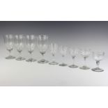 Four 19th Century bell shaped wine glasses together with four 19th Century liqueur glasses with