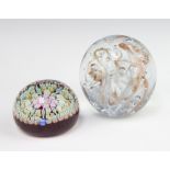 A circular glass and cane paperweight signed P 5cm, together with a bubble glass ditto 7cm