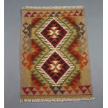 A brown and green ground Maimama Kilim with 2 diamonds to the centre 92cm x 64cm