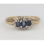 A 9ct yellow gold sapphire and diamond cluster ring, size O