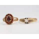 Two 9ct yellow gold gem set rings size N and U, 7 grams
