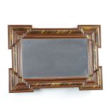 A Dutch style rectangular plate mirror contained in a geometric moulded frame with simulated