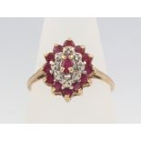 A 9ct yellow gold ruby and diamond cluster ring 2.5 grams, size R