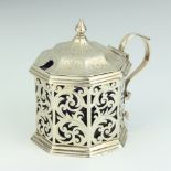 A Victorian octagonal pierced silver mustard pot with blue glass liner Birmingham 1855 90 grams