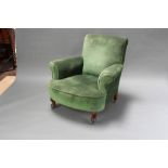 A Howard style armchair upholstered in green material and raised on cabriole supports with metal