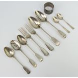 A silver napkin ring, London 1920 and minor silver spoons 250 grams
