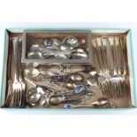 Minor silver souvenir spoons 180 grams together with a plated cigarette box and cutlery