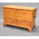 A Victorian pine mule chest with hinged lid, the base fitted 2 drawers, raised on bracket feet