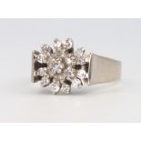 An 18ct white gold diamond cluster ring, 6.1 grams, size J