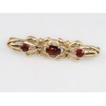 A 9ct yellow gold garnet brooch 3.1 grams, 35mm