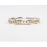 An 18ct white gold diamond half eternity ring, 2 grams, size N