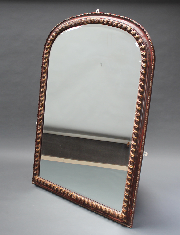 A Victorian style bevelled plate over mantel mirror contained in a decorative gilded frame 152cm x