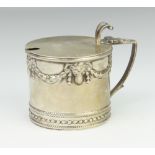 A Victorian circular silver mustard with rams head and festoons (lacking liner) 8cm, 130 grams