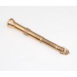 A 9ct yellow gold cigar piercer, 10 grams gross