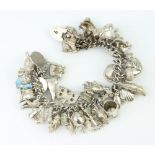 A silver charm bracelet 130 grams