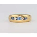 An 18ct yellow gold diamond and sapphire ring, 10.3 grams, size N