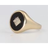 A gentleman's 9ct yellow gold onyx and diamond ring 3.4 grams, size Q