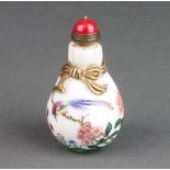A Chinese famille rose baluster snuff bottle and stopper decorated bird among flowers blue character