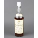 A bottle of 1958 bonded The Macallan pure highland malt whiskyThere is evaporation to the whisky and