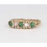 A 9ct yellow gold emerald and diamond ring, 2.8 grams, size K 1/2