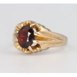 A 9ct yellow gold gents garnet set ring 5.4 grams, size Q