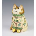 A Rye Pottery Joan and David De Bethel cat dated 1989 with glass eyes and decoupage decoration,