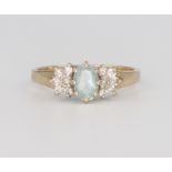 A 9ct yellow gold aquamarine and diamond ring 2.1 grams, size L