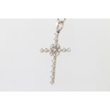 An 18ct white gold paste set cross pendant and chain 4.1 grams