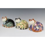 Three Rye Cinque Port Pottery figures of reclining dressed cats with glass eyes 10cm